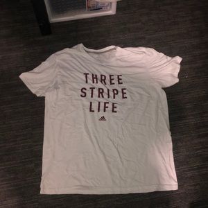 White adidas t-shirt.